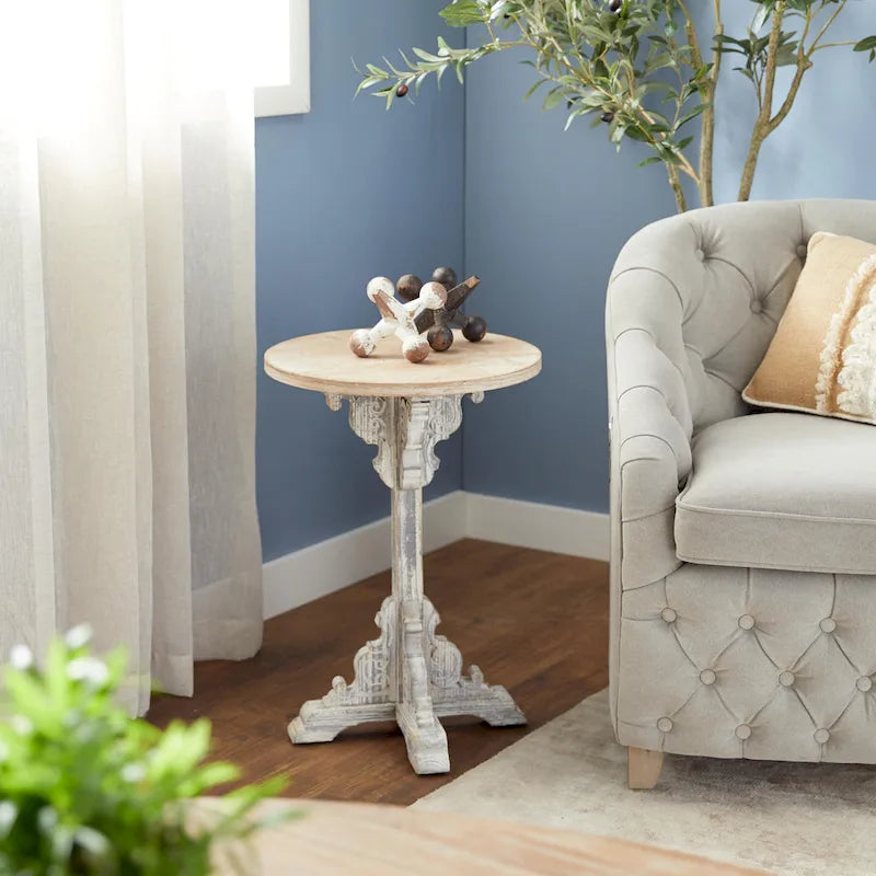 Mesa auxiliar redonda con acento de madera blanca y gris, base en X con detalles florales tallados, 1 persona