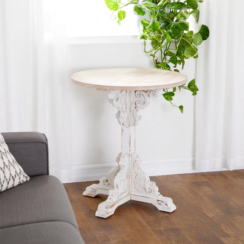 Mesa auxiliar redonda con acento de madera blanca y gris, base en X con detalles florales tallados, 1 persona